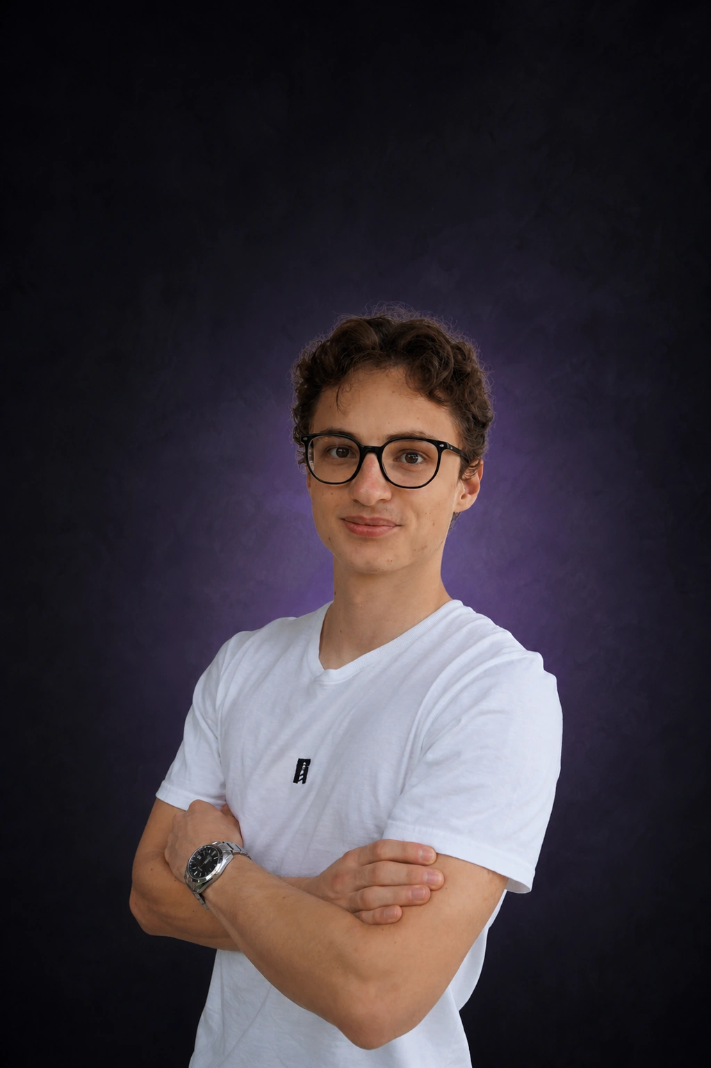 Gabriel Battlogg wearing a white North T-shirt against a dark studio background